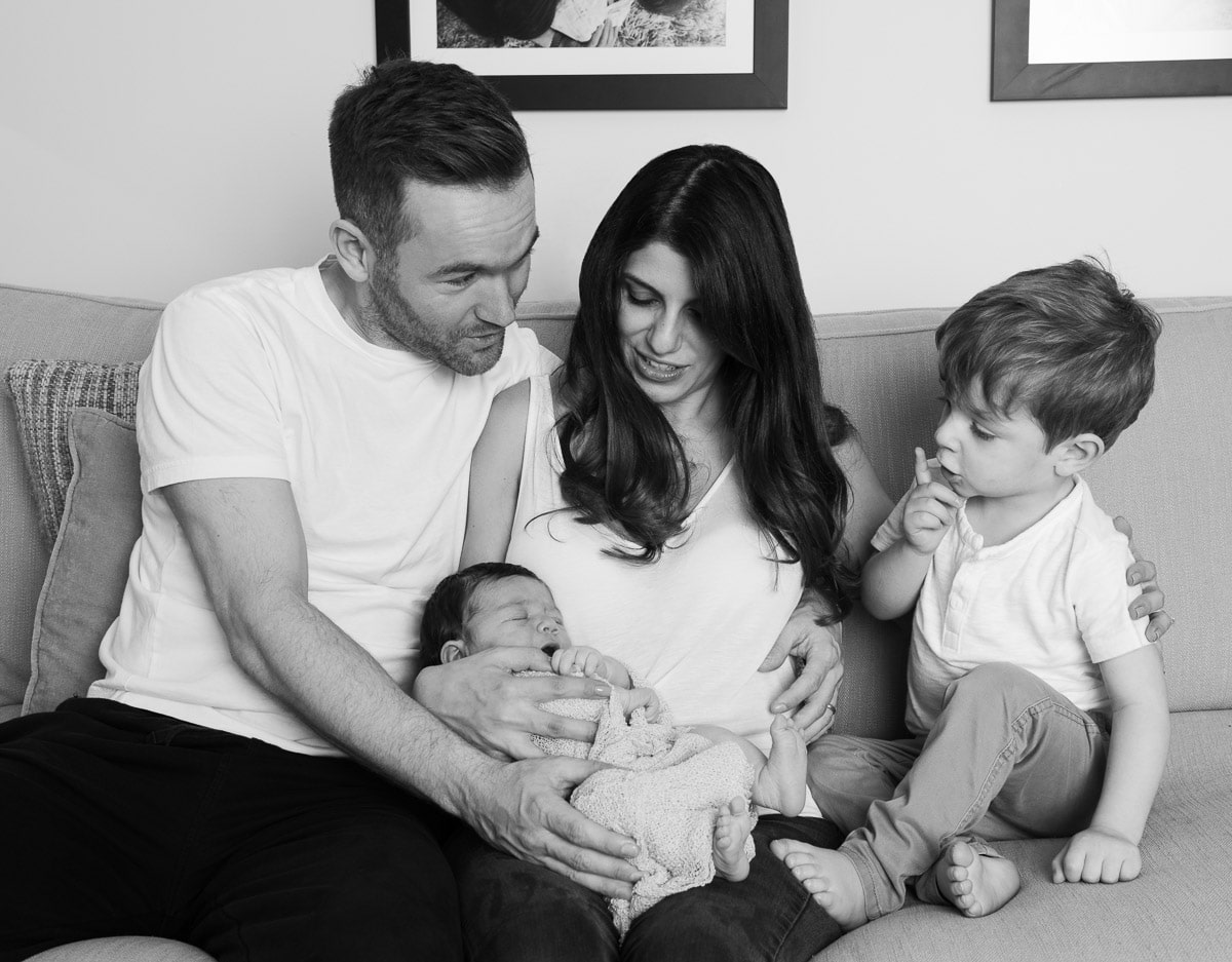 Beautiful Mixed Race Family Of Four Poses In Front Of Their Home High-Res  Stock Photo - Getty Images