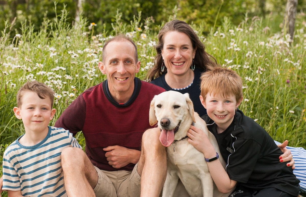 Beautiful Mixed Race Family Of Four Poses In Front Of Their Home High-Res  Stock Photo - Getty Images