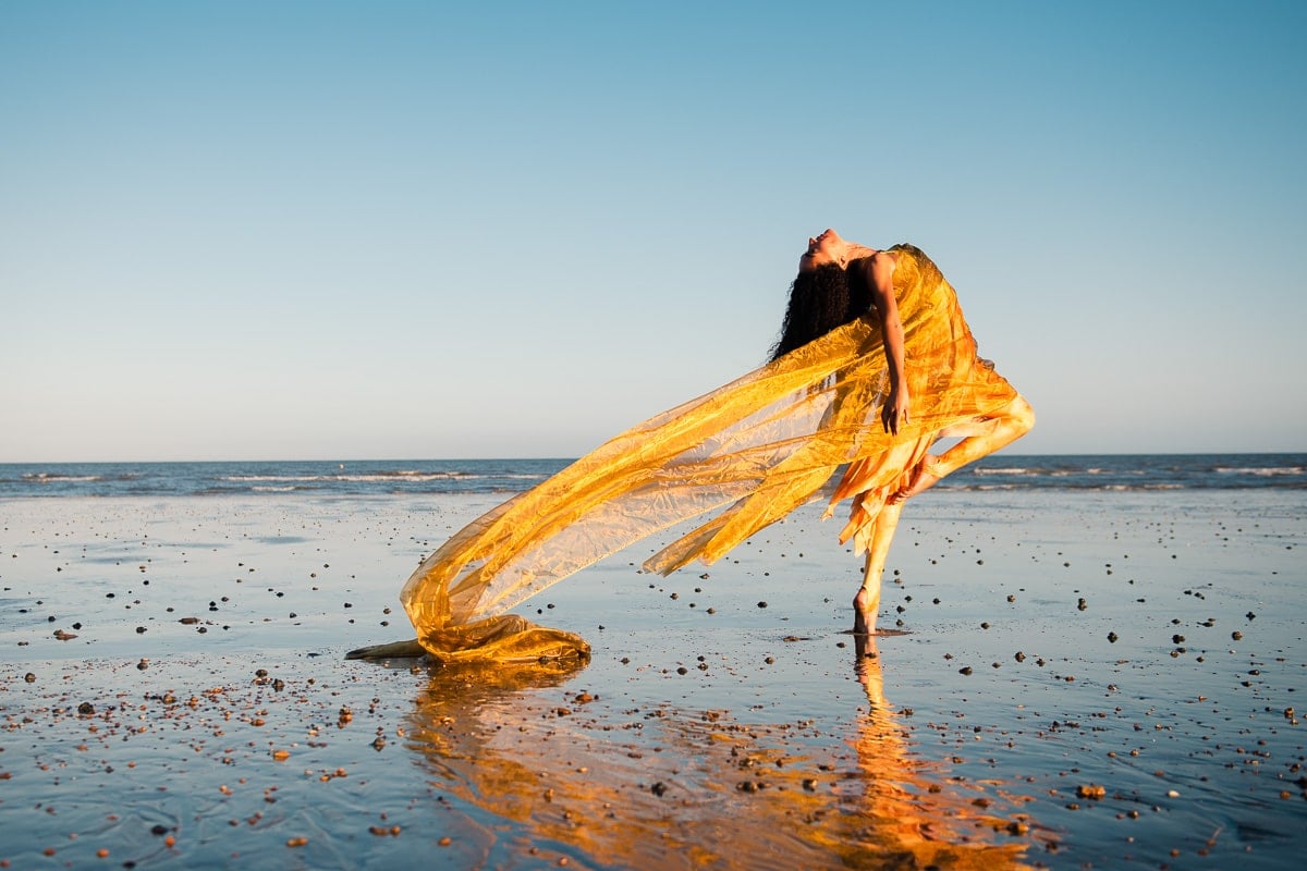 Dancer on beach with continuous focus lock camera setting